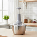 Kitchen blender on a wooden countertop with a kitchen background