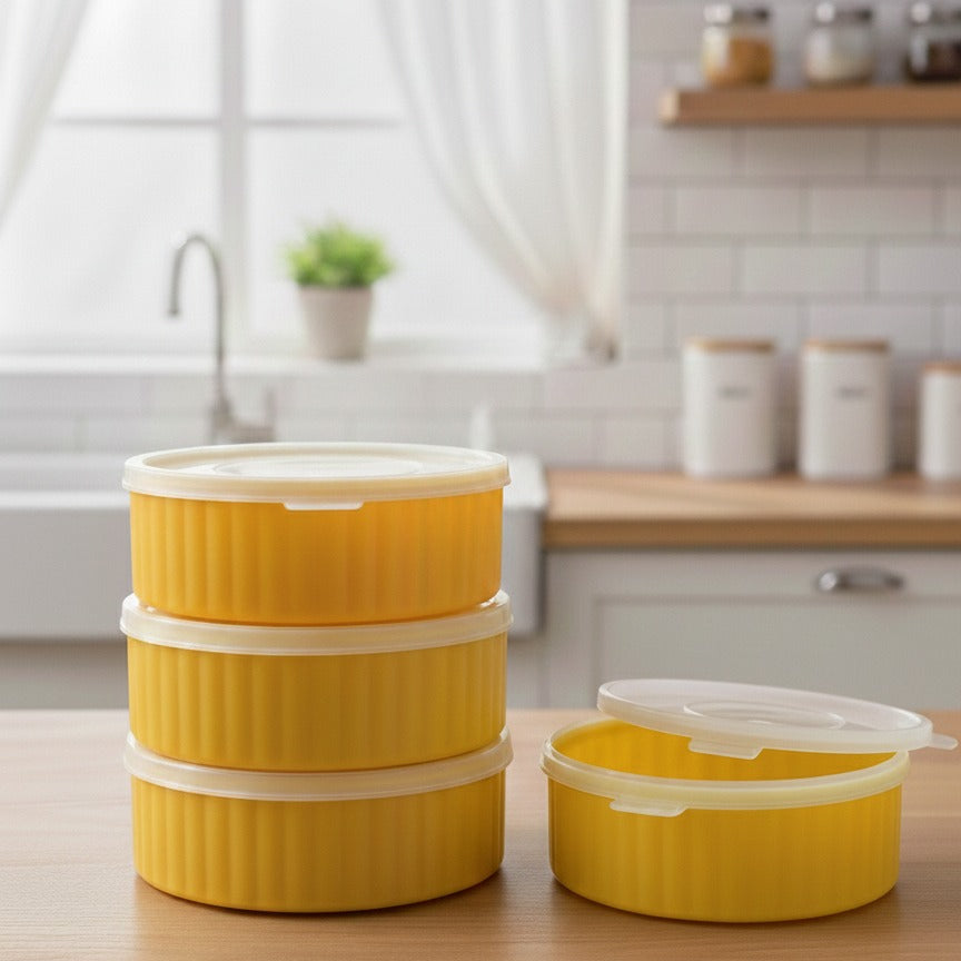 Yellow food containers with lids on a kitchen counter