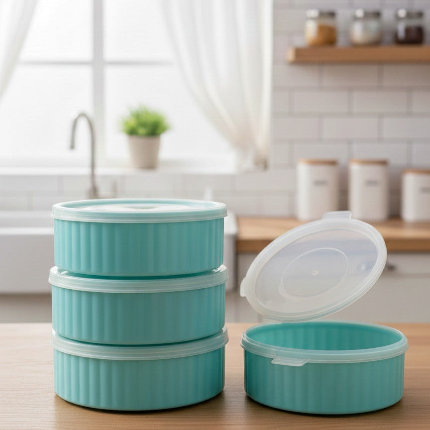 Set of turquoise food containers with white lids on a kitchen counter.