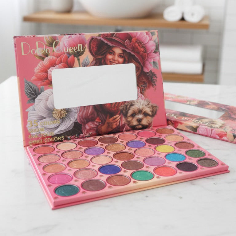 Makeup palette with colorful shades on a white surface, with a blurred bathroom background.